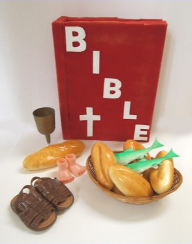 The Bible, five loaves, two fish, sandals, and a chalice