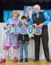 Rainbow, an audience member, and Mr. T with a sign saying "Jesus"